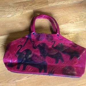 Red and black handbag with elephant design
